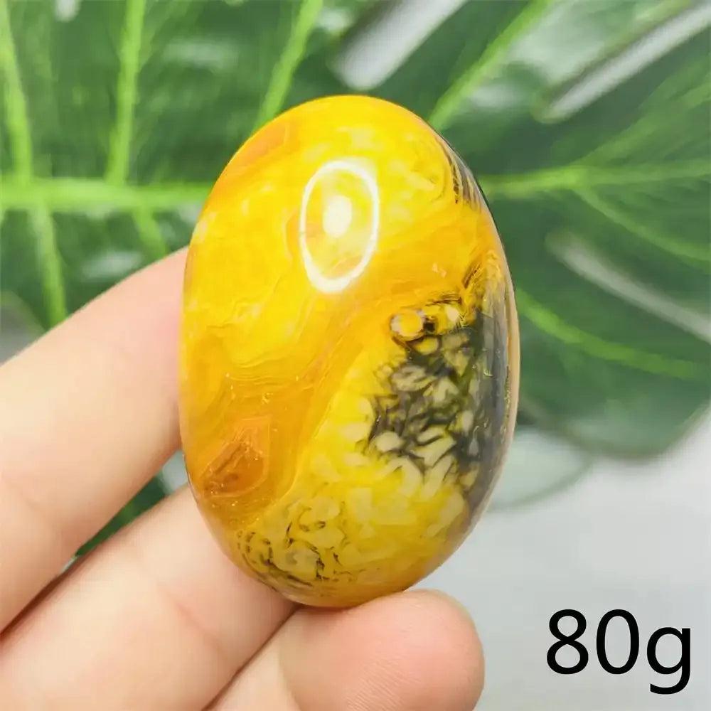 Smooth Bumblebee Jasper palm stone featuring vibrant yellow, orange, and black stripes for optimism and motivation.