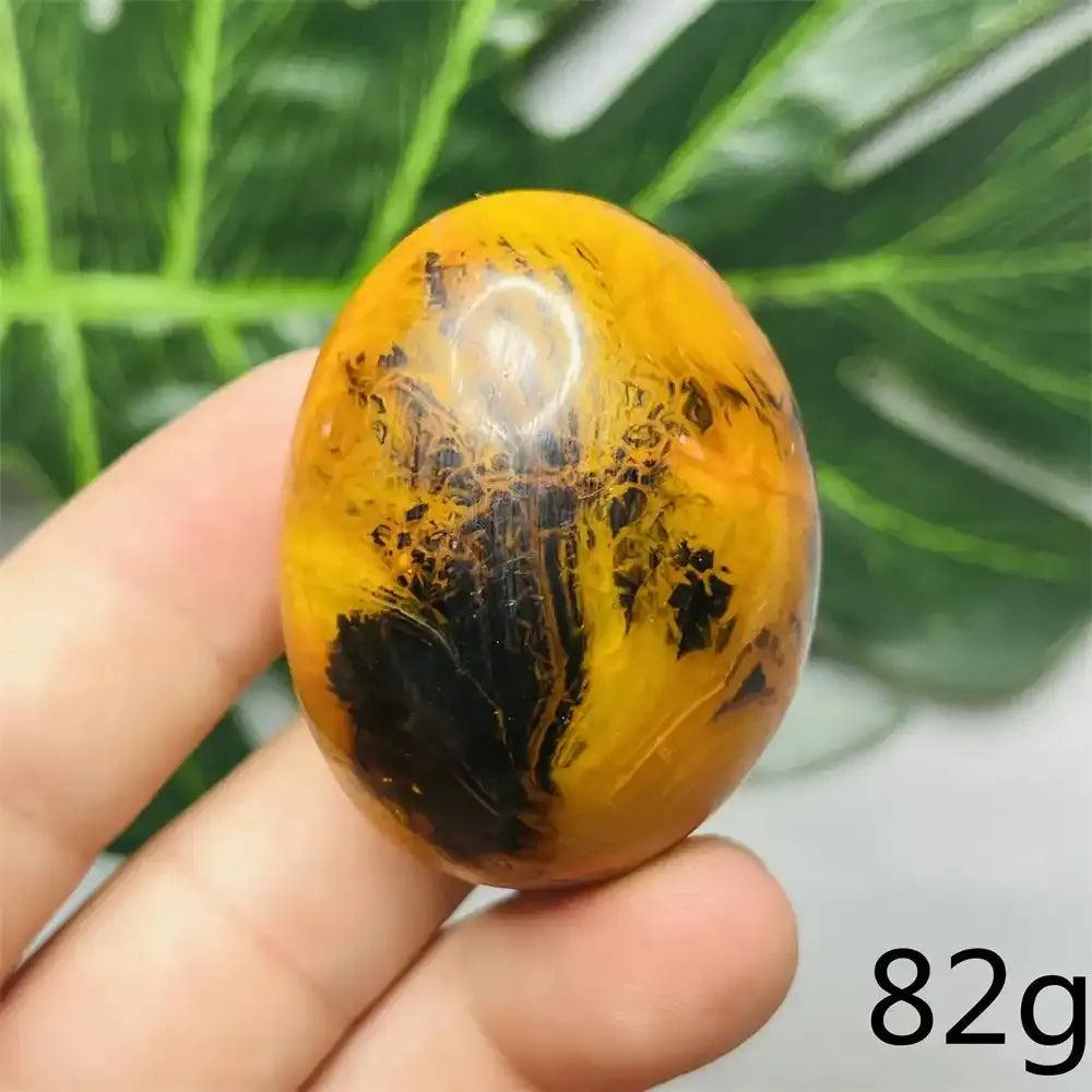 Smooth Bumblebee Jasper palm stone featuring vibrant yellow, orange, and black stripes for optimism and motivation.