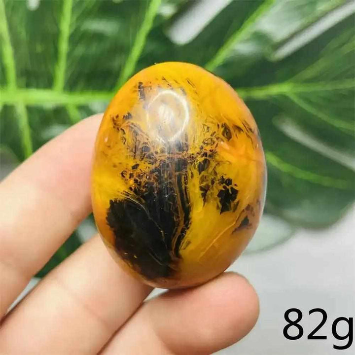 Smooth Bumblebee Jasper palm stone featuring vibrant yellow, orange, and black stripes for optimism and motivation.