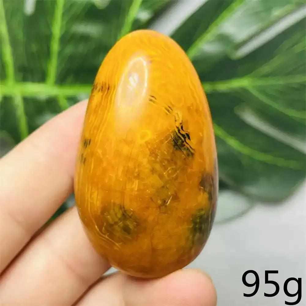 Smooth Bumblebee Jasper palm stone featuring vibrant yellow, orange, and black stripes for motivation and energy.