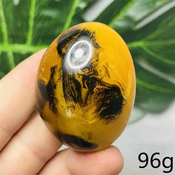 Polished 96g Bumblebee Jasper palm stone with vibrant yellow, orange, and black stripes for Solar Plexus chakra healing.