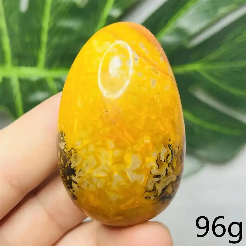 Smooth Bumblebee Jasper palm stone featuring vibrant yellow, orange, and black stripes for optimism and solar plexus energy.