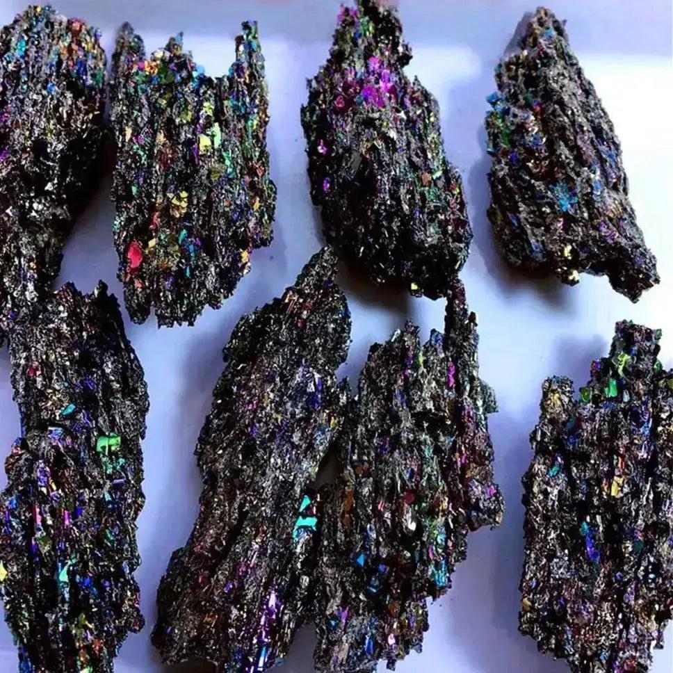 Carborundum Silicon Carbide Crystal Specimen Rainbow, raw iridescent pieces with deep blues, violet, gold, and green.