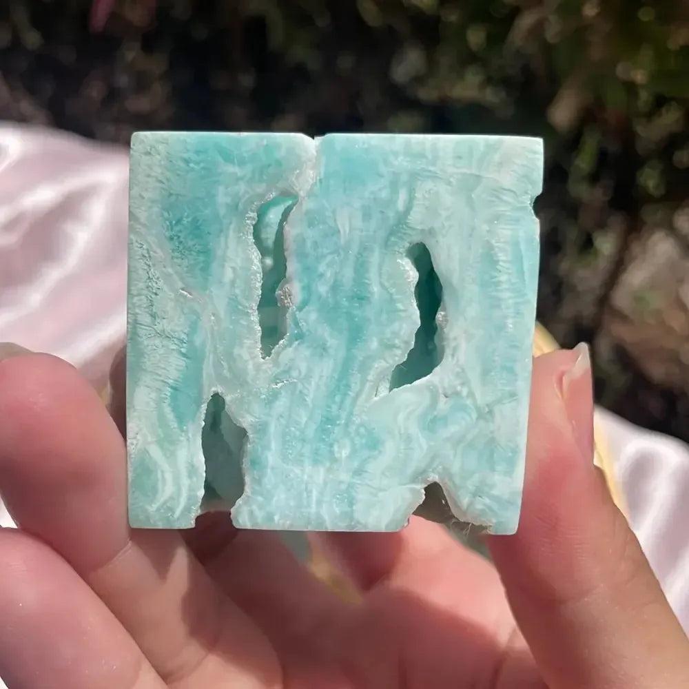 Caribbean Blue Calcite Crystal Cube from Crystal Destiny, with serene blue and white swirls, calming energy.