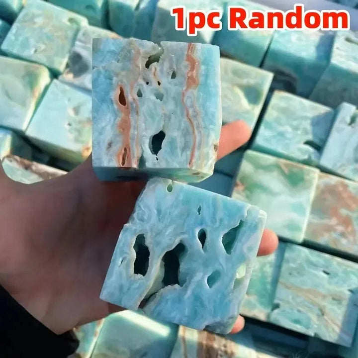 Caribbean Blue Calcite crystal cubes by Crystal Destiny, featuring natural blue, white, and brown swirls with organic holes.