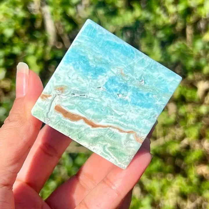 Caribbean Blue Calcite Crystal Cube from Crystal Destiny, featuring calming blue, white, and brown swirls.