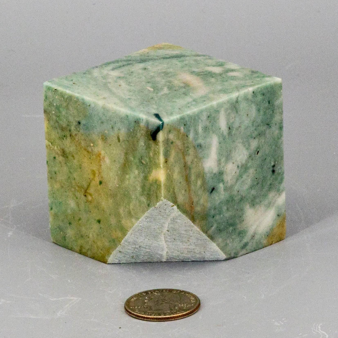 Caribbean Calcite Cut Corner Cube: Aqua and teal crystal with white and brown banding, evoking tropical waters.