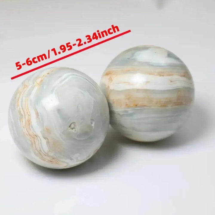 Two polished Caribbean Calcite spheres, 5-6cm, with tranquil blue, white, and tan bands from Crystal Destiny.