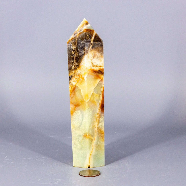 Polished Caribbean Calcite Tower XXL with soft blue, creamy white, and warm brown banding for calm communication.