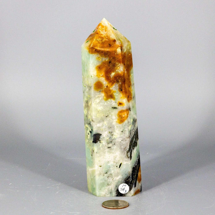 XXL Caribbean Calcite Tower: Polished crystal with soft blue, white, and warm brown banding for calm, clear communication.