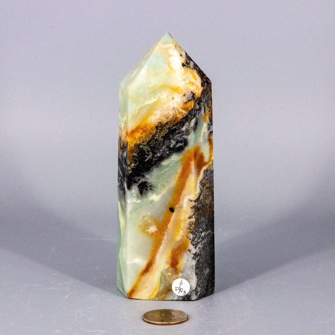XXL Caribbean Calcite Tower: Polished crystal with soft ocean blue, creamy white, and warm brown banding.