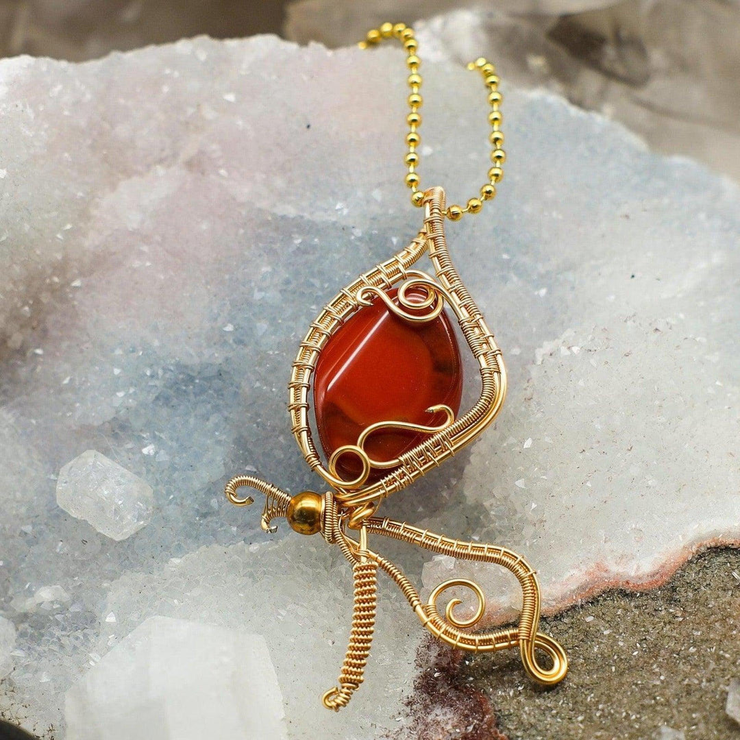 Vibrant Carnelian butterfly wire wrap pendant, handcrafted copper, symbolizing transformation, vitality, and courage.