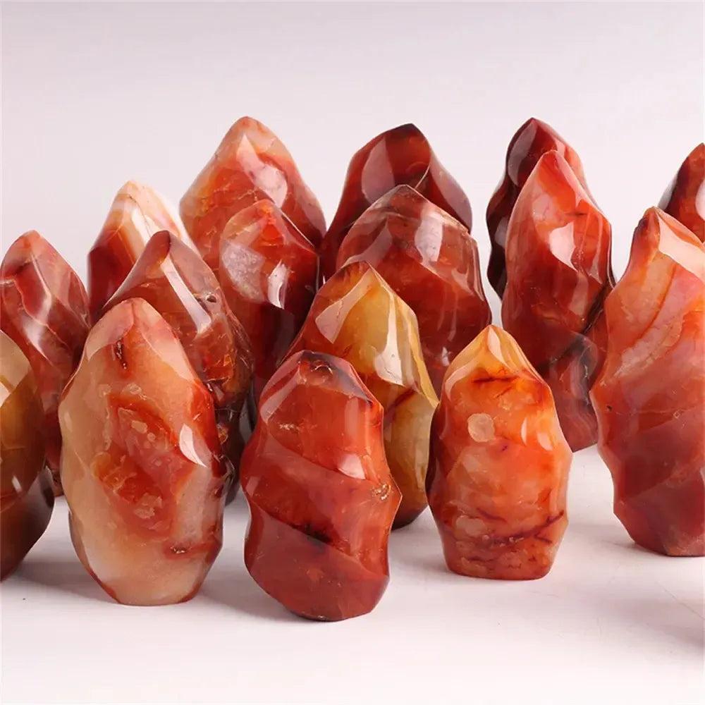 Vibrant Carnelian Crystal Flame, hand-carved with fiery orange-red hues, boosting vitality and creativity.