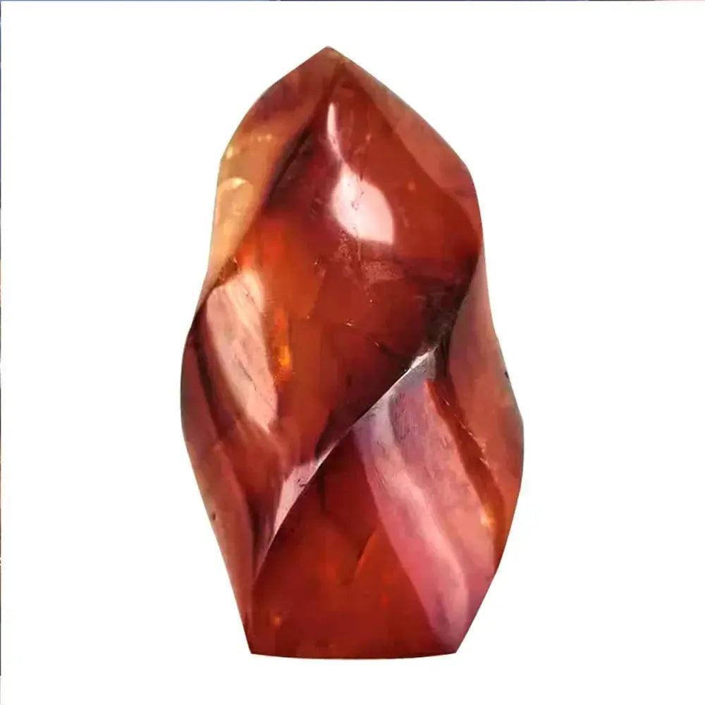 Vibrant Carnelian crystal flame from Crystal Destiny, showcasing fiery orange-red hues and a polished, twisted design.