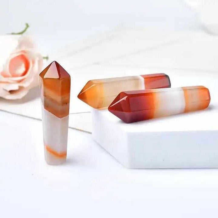 Polished 55mm Carnelian hexagonal crystal point in vibrant orange and red for creative energy and Sacral Chakra healing.