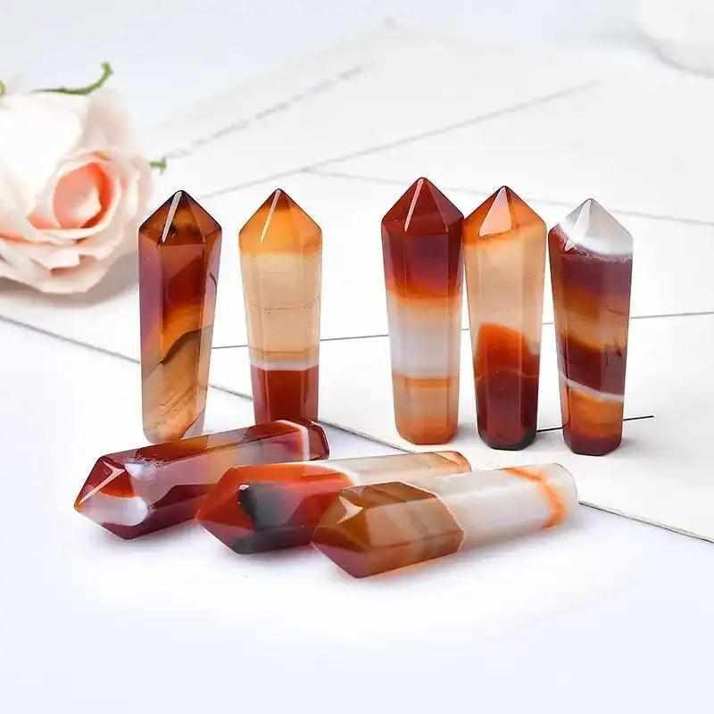 Polished 50-55mm Carnelian hexagonal crystal points in vibrant orange and red shades for creativity and confidence.