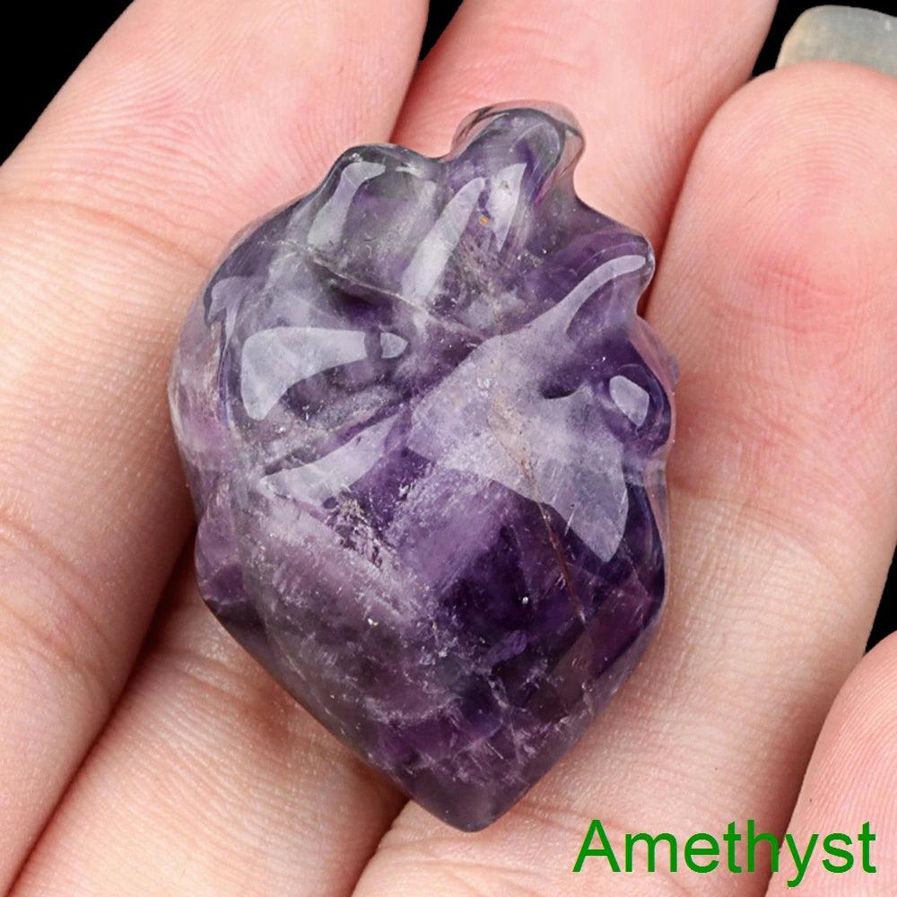 Polished amethyst mini human heart model statue, a natural crystal love stone for reiki and decor.