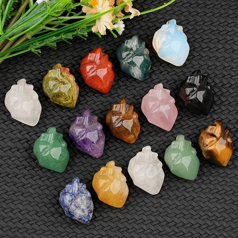 Assorted natural crystal human heart model statues, including amethyst, rose quartz, and tiger's eye, for decor and reiki.