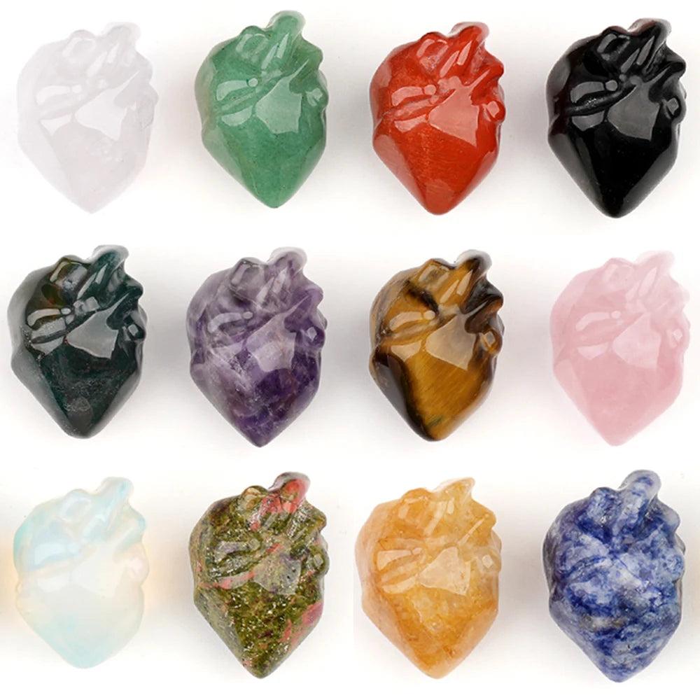 Assorted natural crystal human heart model statues, including amethyst, rose quartz, and tiger's eye, for decor and reiki.