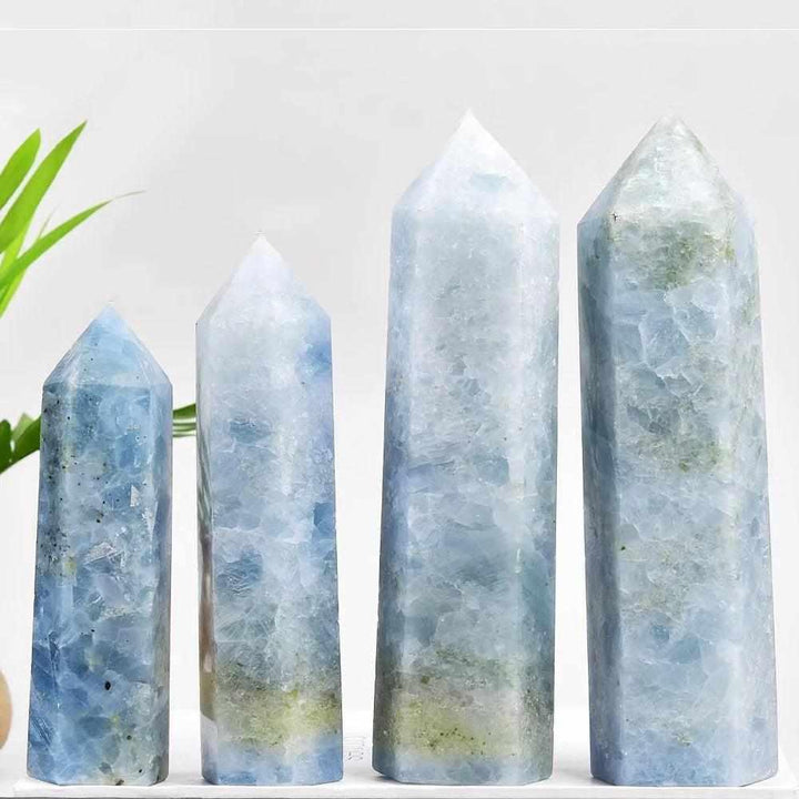 Four pale blue Celestite crystal towers with single-terminated points for calming energy and meditation spaces.