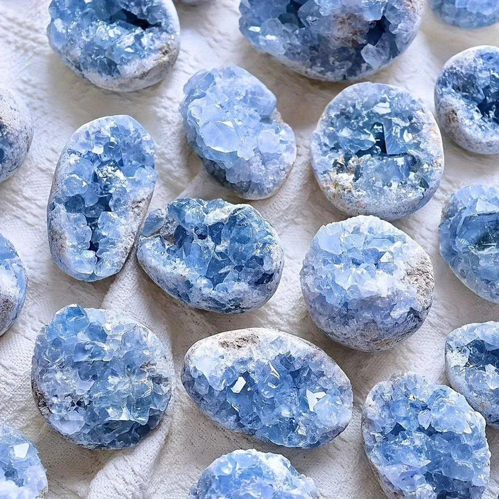 Large natural sky blue celestite geode clusters with sparkling raw druzy crystals for peaceful home decor and sleep healing.