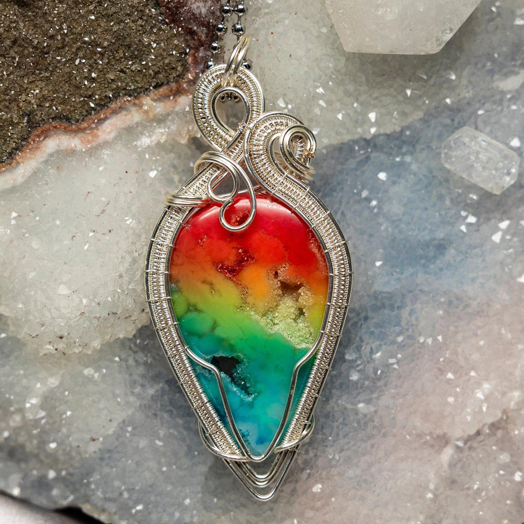 Chakra Agate Crystal Wire Wrap Pendant: 3-inch rainbow agate in intricate silver wire for full energetic alignment.