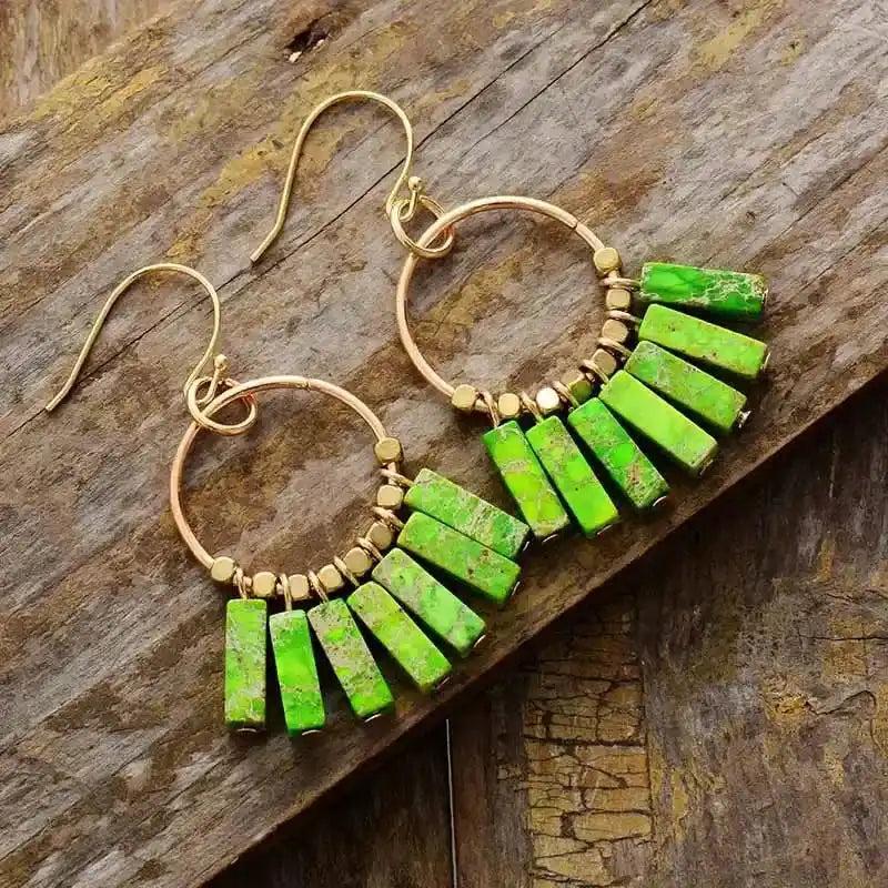 Gold-plated hoop earrings with vibrant green jasper rectangle beads, perfect for energy alignment and stylish wear.