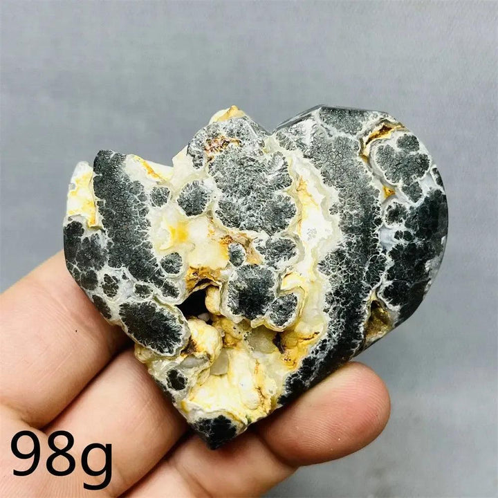 Chalcopyrite Agate geode heart by Crystal Destiny, showing black, white, and yellow druzy crystals.