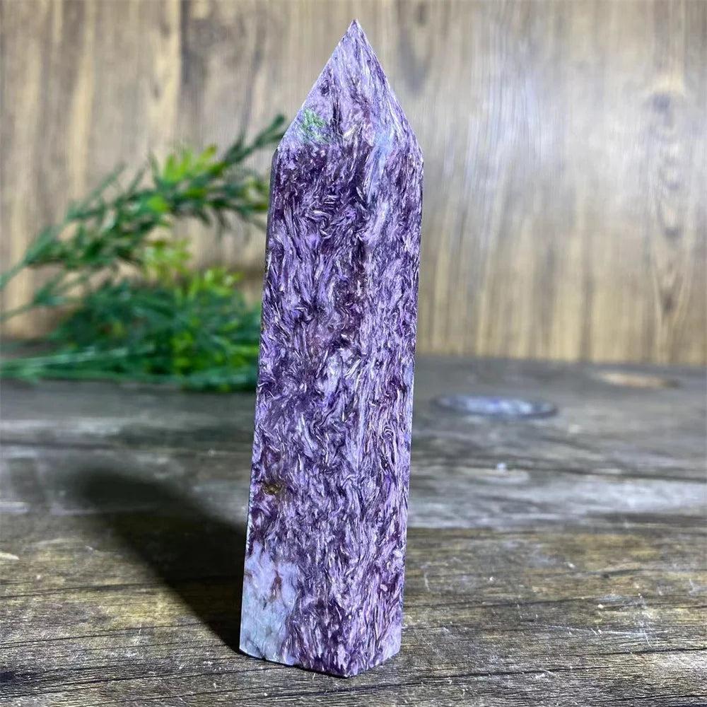 Rare Charoite Crystal Tower with deep, swirling violet, white, and black patterns, focusing Crown Chakra energy.