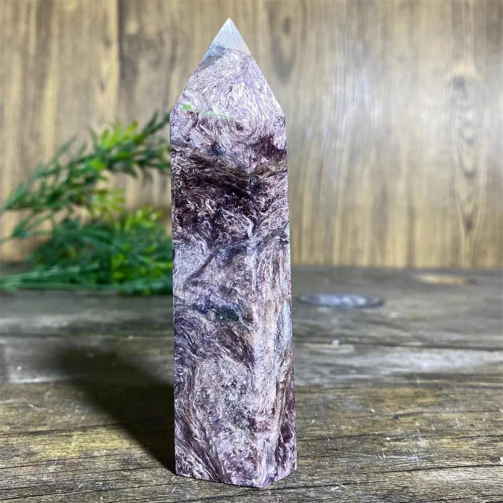 Charoite Crystal Tower with deep, swirling violet, white, and black patterns, a powerful natural stone wand specimen.