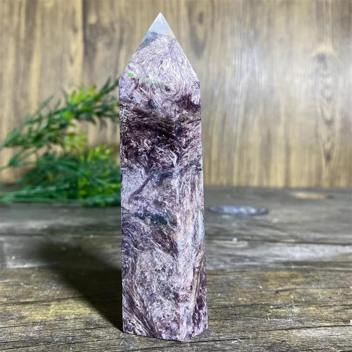 Charoite Crystal Tower with deep, swirling violet, white, and black patterns, a powerful natural stone wand specimen.
