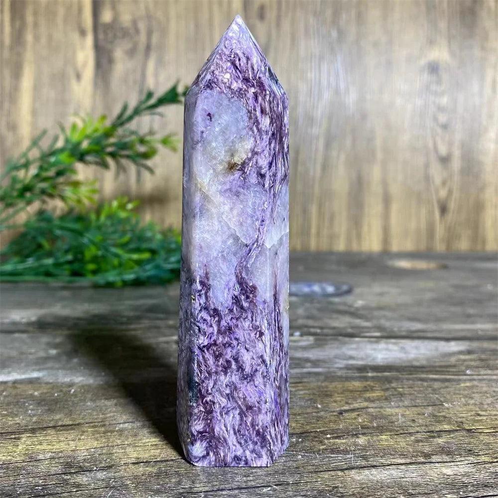 Charoite Crystal Tower with deep, swirling violet and white patterns, a powerful natural stone wand specimen.