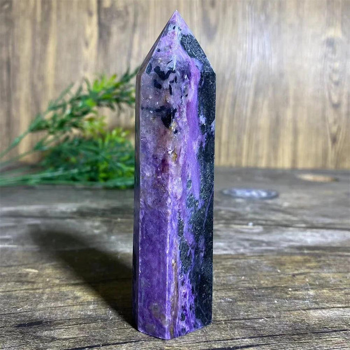 Charoite Crystal Tower: Deep swirling violet natural stone wand with threads of white and black, focusing Crown Chakra energy.