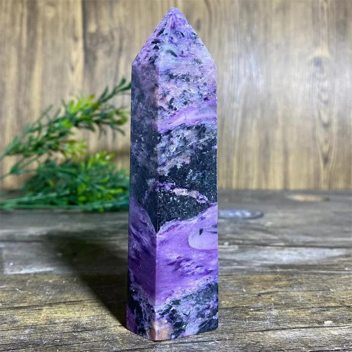 Charoite Crystal Tower: Deep swirling violet natural stone wand with white, black, and lavender patterns.