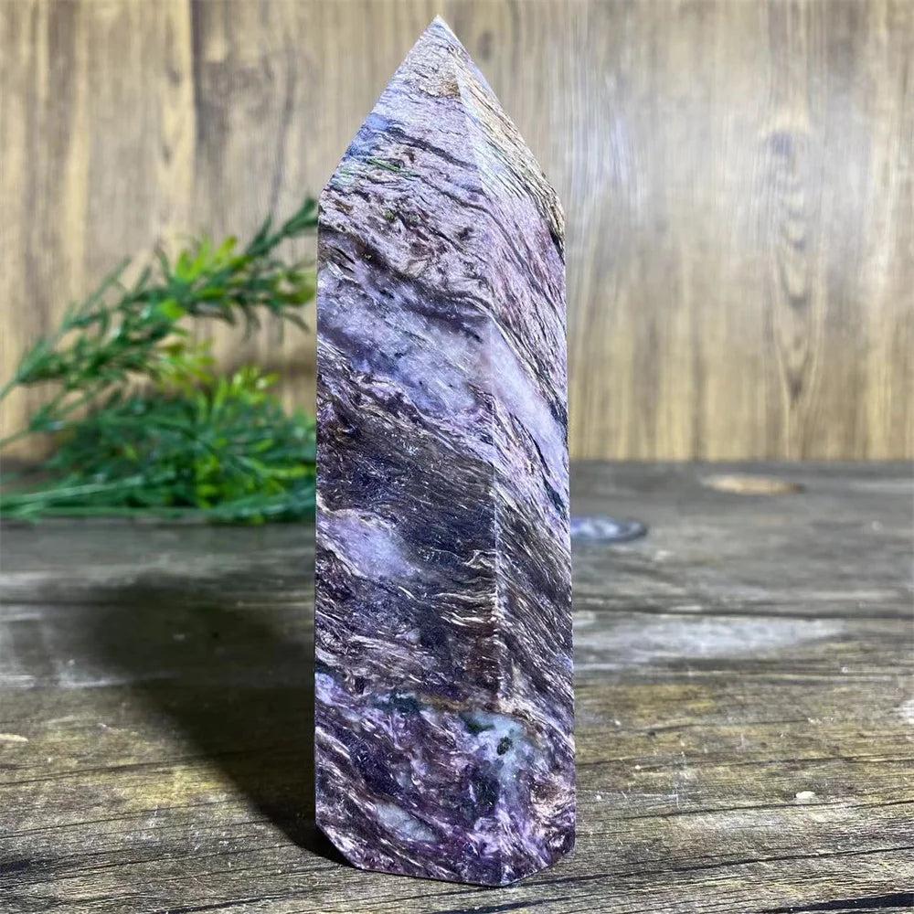 Charoite Crystal Tower with deep, swirling violet, white, and black patterns, a powerful natural stone wand specimen.