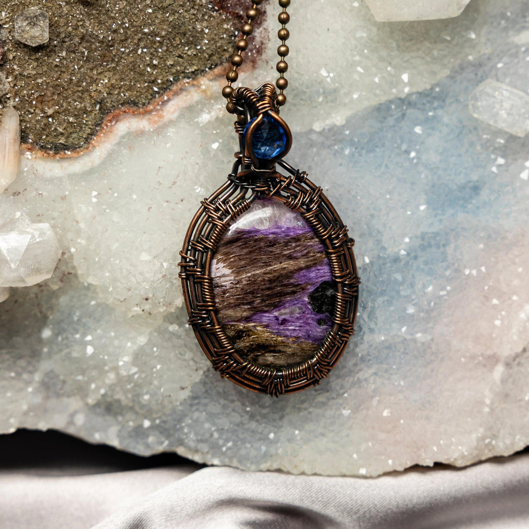 Double Charoite Wire Wrap Pendant: 2.5-inch handcrafted copper pendant with swirling violet-purple Charoite stones.