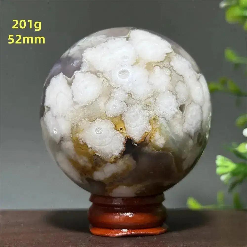 Cherry Agate Crystal Sphere, 201g 52mm, with unique white, red, and pink banding on a wooden base.