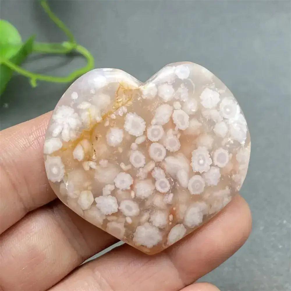 Cherry Blossom Agate Heart: Polished pink and white agate heart with unique floral-like inclusions for emotional healing.