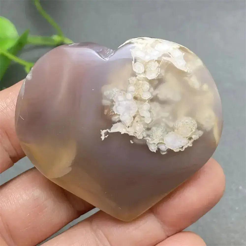 Cherry Blossom Agate Heart: Polished pink and white agate heart with unique floral inclusions, promoting self-love.