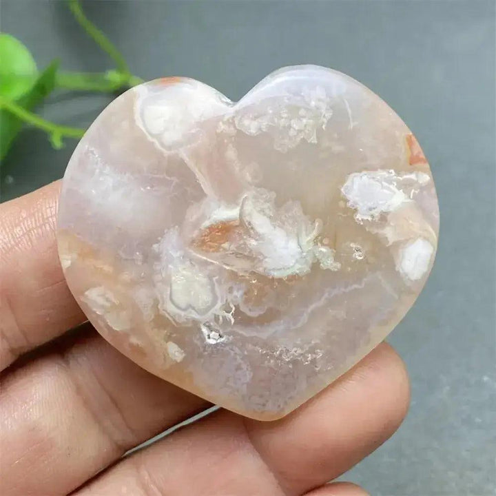Cherry Blossom Agate Heart: Polished pink and white agate heart with unique floral inclusions, promoting self-love.