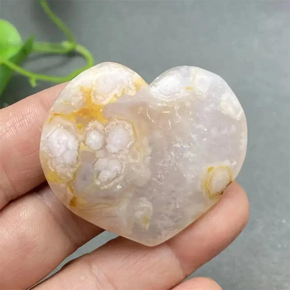 Cherry Blossom Agate Heart: Hand-polished, delicate pink and white stone with unique floral inclusions, promoting self-love.