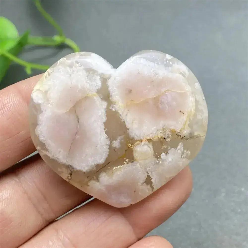 Cherry Blossom Agate Heart: Polished pink and white crystal, promoting emotional healing and self-love.