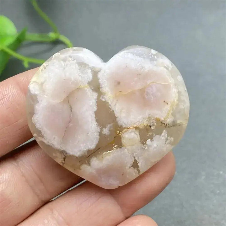 Cherry Blossom Agate Heart: Polished pink and white crystal, promoting emotional healing and self-love.