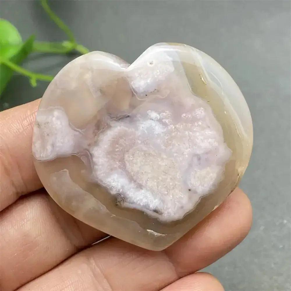 Cherry Blossom Agate Heart: Polished pink and white agate heart with unique floral-like inclusions, promoting self-love.