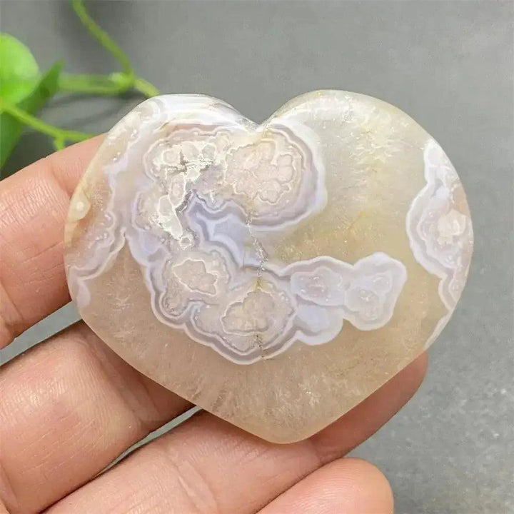 Cherry Blossom Agate Heart: Polished pink and white agate heart with unique floral-like inclusions, promoting self-love.