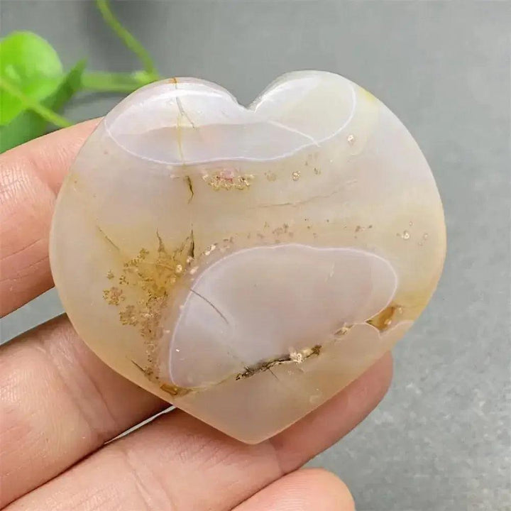 Polished Cherry Blossom Agate Heart, showcasing delicate pink and white floral patterns for emotional healing and self-love.