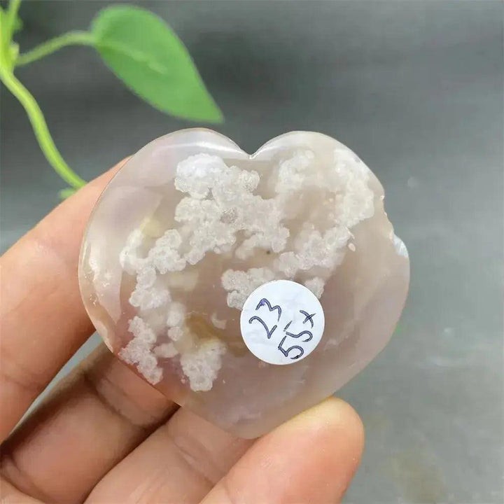 Cherry Blossom Agate Heart: Hand-polished, pink and white crystal with unique floral inclusions, promoting self-love.