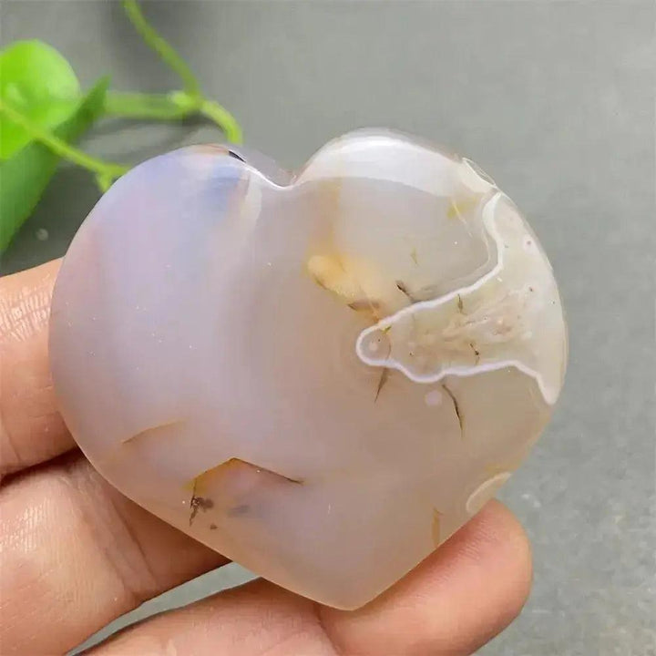 Polished Cherry Blossom Agate Heart with delicate pink and white floral patterns, promoting emotional healing and self-love.