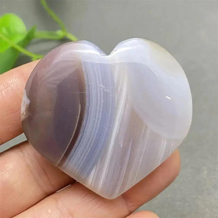 Polished Cherry Blossom Agate Heart, showcasing delicate pink, white, and purple floral-like patterns for emotional healing.