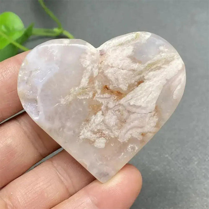 Polished Cherry Blossom Agate Heart with delicate pink and white floral patterns, promoting self-love and emotional healing.